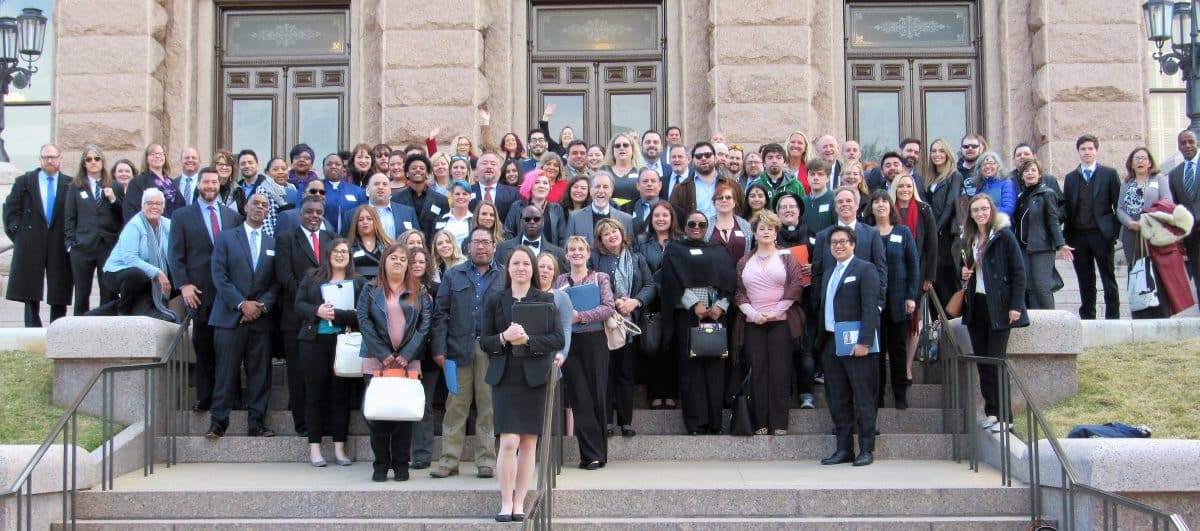 advocates for prevention, treatment and recovery pose on the steps of the Texas Capitol