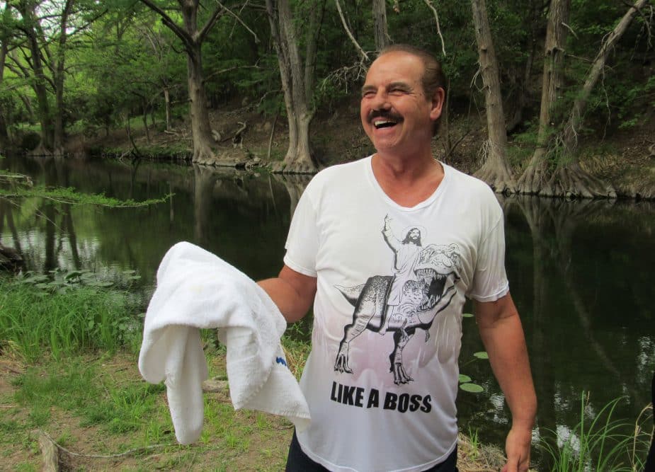 Clay Eaton performs baptisms in the Guadalupe River