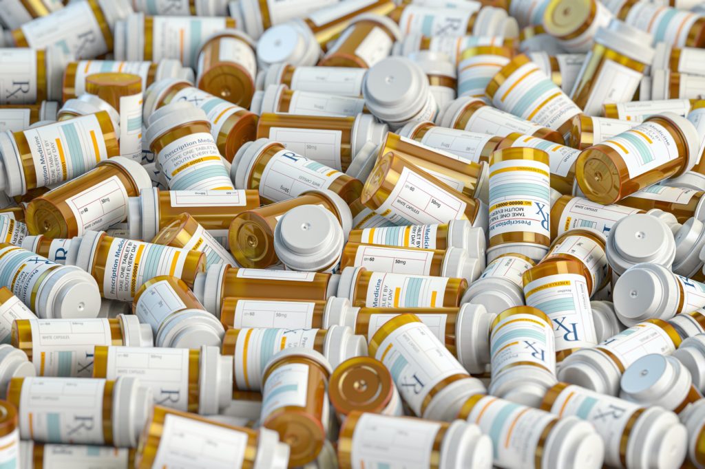 La Hacienda Treatment - Prescription medicine pill bottles background. Medicine and pharm
